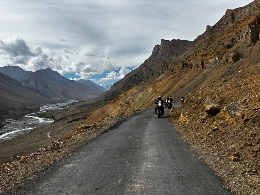 Riders on a mountain road above the Spiti River valley